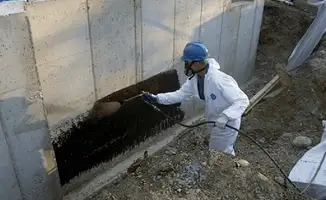 Professional waterproofing the exterior walls of the basement in Pueblo, CO